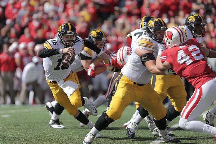 Iowa quarterback C.J. Beathard runs from Wisconsin linebackers at Camp Randall Stadium in Madison, Wisconsin on Saturday, Oct. 3, 2015. The Hawkeyes defeated the Badgers, 10-6. (The Daily Iowan/Rachael Westergard)