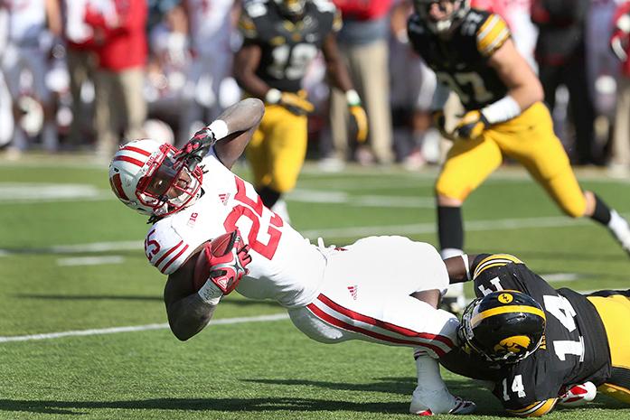 Wisconsin running back Melvin Gordon III gets tackled by Iowa defensive back Desmond King in Kinnick Stadium on Saturday, Nov. 2, 2013. King had seven tackles on the game. Wisconsin defeated Iowa, 28-9. (The Daily Iowan/Tessa Hursh)