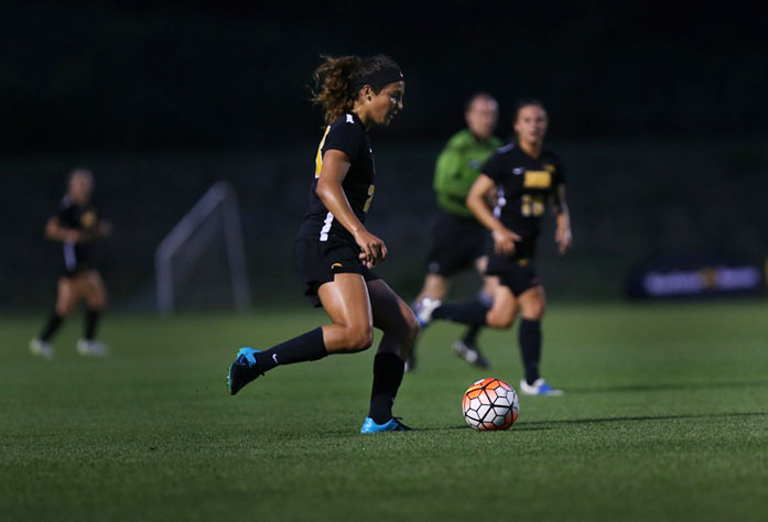 Iowa forward Katharine Woodruff dribbles the ball during the SDSU-Iowa game at the Soccer Complex on Friday, August 28, 2015. Due to inclement weather the game was canceled after 20 mintues of game time with no score. (The Daily Iowan/Margaret Kispert)
