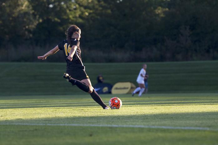 Iowa midfielder Kyrie Seying kicks the ball during the game on Friday, September 11, 2015. The Hawkeyes defeated the Cyclones, 1-0. (The Daily Iowan/Peter Kim)