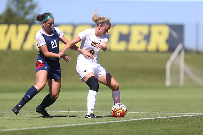 Iowa defender Amanda Lulek protects the ball from Chicago forward Emily Wauer at the Iowa Soccer Complex on Sunday, Sept. 13, 2015. The Hawkeyes defeated the Flames 3-0. (The Daily Iowan/Valerie Burke)