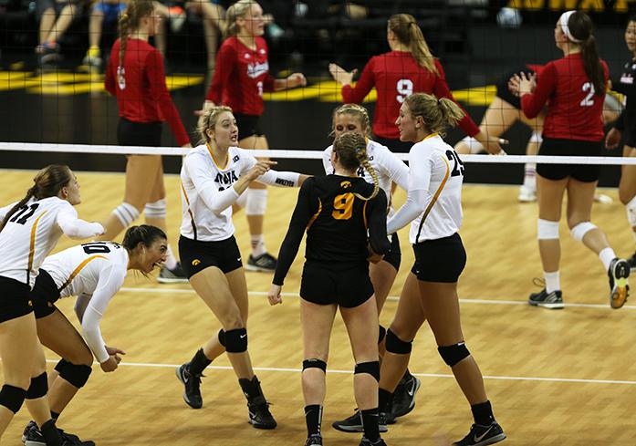 Iowa Womens Volleyball team comes together to cheer during the match against Nebraska team at Carver Arena on Wednesday, Sept. 23, 2015. The Hawkeyes lost to the Cornhuskers, who are ranked number 4 in the nation. (The Daily Iowan/Lexi Brunk)