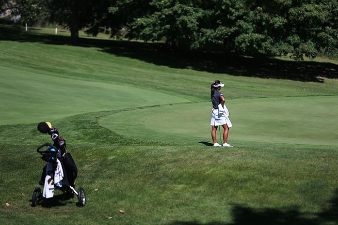 Iowa golfer Jessica Ip watches other golfers put in the last hole of the Diane Thomason Invitational at Finkbine on Sunday, Sept. 13, 2015. The Hawkeyes finished a three-round with 888, 25-over par with Rutgers finished second 18 strokes behind Iowa. (The Daily Iowan/Margaret Kipsert)