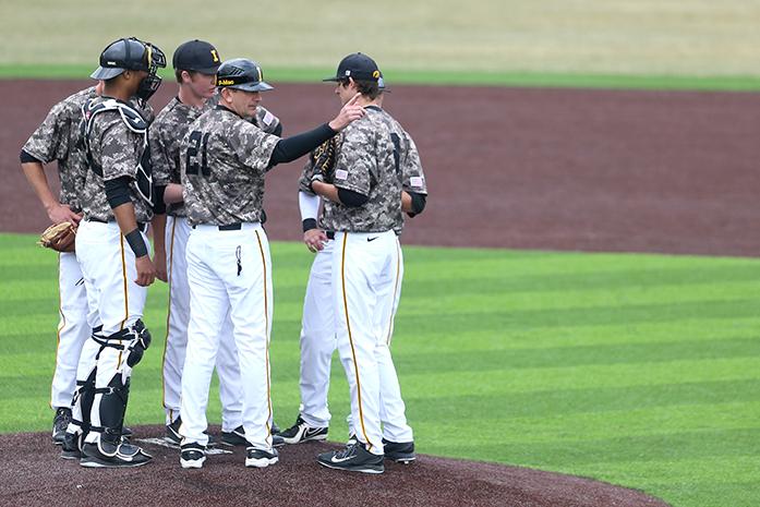 Iowa head coach Rick Heller signals for pitcher Tyler Radtke during the third game of the series at Duane Banks Field on Monday, April 7, 2014. Indiana defeated Iowa, 5-3. (The Daily Iowan/Tessa Hursh)