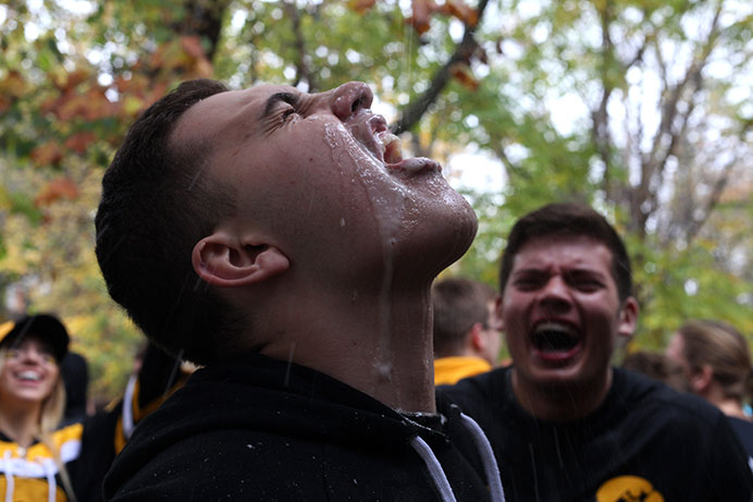 An+Iowa+fan+drinks+beer+at+a+tailgate+on+Melrose+Court+on+Saturday%2C+Oct.+31%2C+2015.+Iowa+played+Maryland+and+defeated+the+Terrapins%2C+31-15.+%28The+Daily+Iowan%2FMikaela+Parrick%29