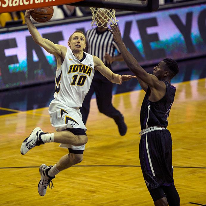Iowa guard Mike Gesell drives against Sioux Falls in Carver-Hawkeye on Oct. 29. The Hawkeyes defeated the Cougars, 99-73. (The Daily Iowan/Joshua Housing)