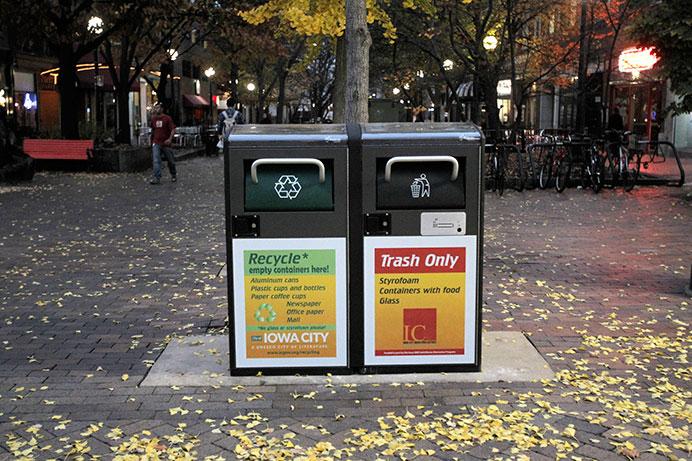 Two new solar powered trash and recycling cans sit in the ped mall on Wednesday, Nov 4, 2015. There are currently four downtown, and if proven successful the city will put in more. (The Daily Iowan/Lexi Brunk)
