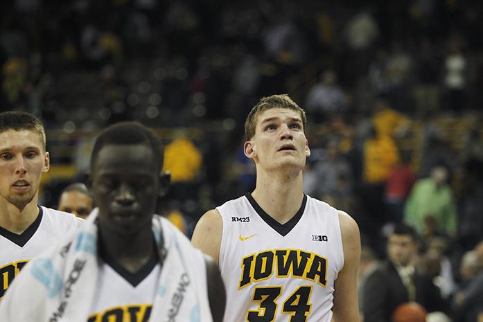 Iowa center Adam Woodbury walks off the court after the game against Augustana in Carver-Hawkeye Arena on Friday, Nov. 6, 2015. The Vikings defeated the Hawkeyes, 76-74. (The Daily Iowan/Joshua Housing)
