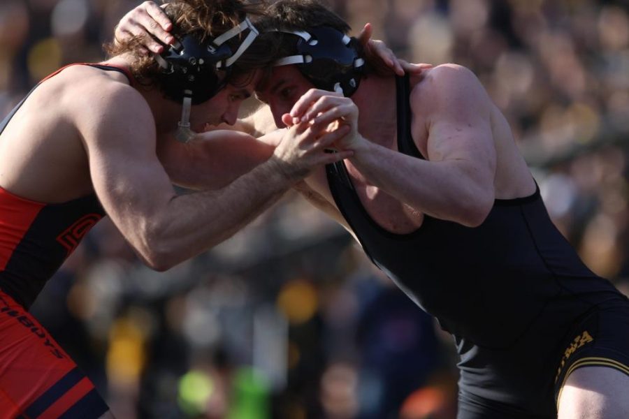 Iowas Sammy Brooks wrestles against Oklahoma States Jordan Rogers in the 184-pound match in Kinnick Stadium on Saturday, Nov. 14, 2015. Brooks defeated Rogers by technical fall in 4:09, 17-2. The Hawkeyes defeated the Cowboys, 18-16. (The Daily Iowan/Joshua Housing)