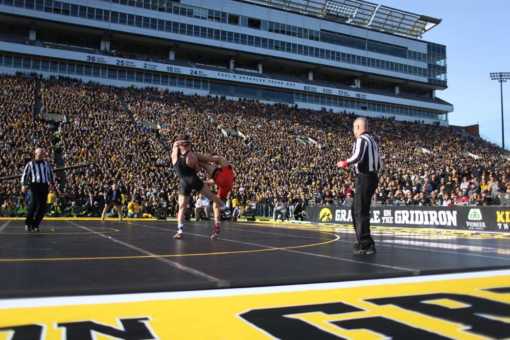 Iowa's Sammy Brooks sweeps Oklahoma State's Jordan Rogers leg in the 184-pound match in Kinnick Stadium on Saturday, Nov. 14, 2015. Brooks defeated Rogers by technical fall in 4:09, 17-2. The Hawkeyes defeated the Cowboys, 18-16. (The Daily Iowan/Joshua Housing)