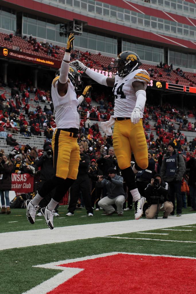 Iowa defensive back Desmond King and a teammate greet each other before the Iowa-Nebraska game at Memorial Stadium on Nov. 27. The attendance for the game was 90,830. (The Daily Iowan/ John Theulen)