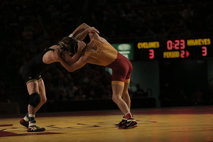 Iowa 149-pounder Brandon Sorenson and Iowa State's Gabe Moreno wrestle during the Cy-Hawk series in Hilton Coliseum on Sunday, Nov. 29, 2015. Sorensen won by a major decision over Moreno. The Hawkeyes defeated the Cyclones, 33-6. (The Daily Iowan/Margaret Kispert)