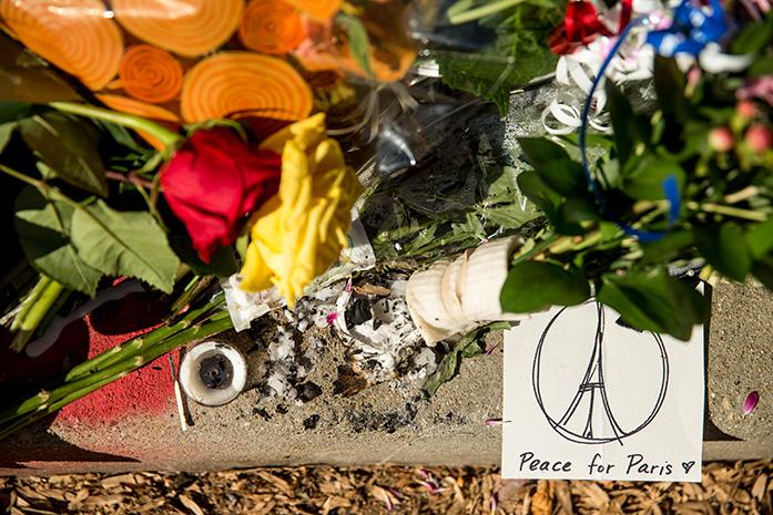Mourners+leave+flowers+and+cards+outside+the+gates+of+the+French+Embassy+in+Washington%2C+Sunday%2C+Nov.+15%2C+2015.+The+Islamic+State+group+claimed+responsibility+for+Fridays+attacks+on+a+stadium%2C+a+concert+hall+and+Paris+cafes+that+left+more+than+120+people+dead+and+over+350+wounded.++%28AP+Photo%2FAndrew+Harnik%29