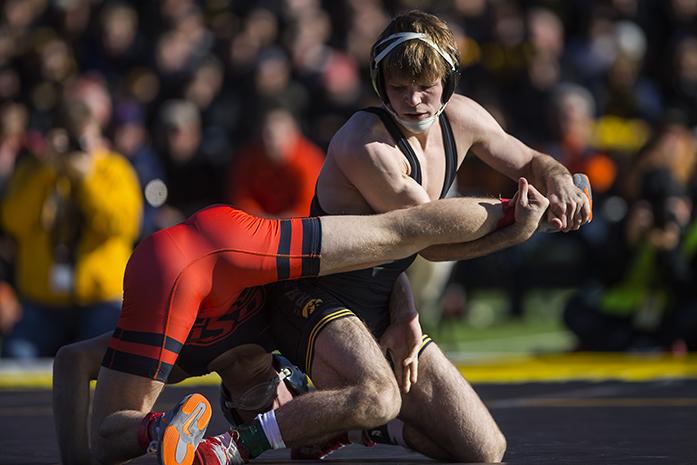Iowas Cory Clark wrestles against Oklahoma States Gary Wayne Harding in the 133  pound match in Kinnick Stadium on Saturday, Nov. 14, 2015. Clark defeated Harding by decision, 8-2. The Hawkeyes defeated the Cowboys, 18-16. (The Daily Iowan/Joshua Housing)