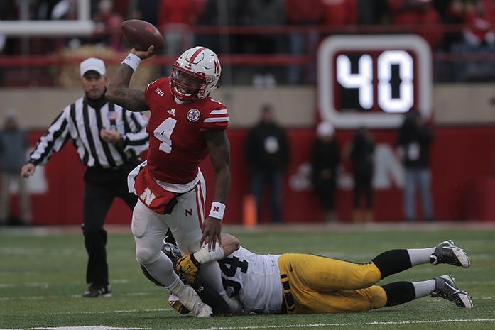 Iowa defensive end Nate Meier attempts to sack Nebraska quarterback Tommy Armstrong, Jr. during the Iowa-Nebraska game at Memorial Stadium on Friday, Nov. 27, 2015. The Hawkeyes defeated the Cornhuskers, 28-20, to finish off a  perfect regular season. (The Daily Iowan/Margaret Kispert)