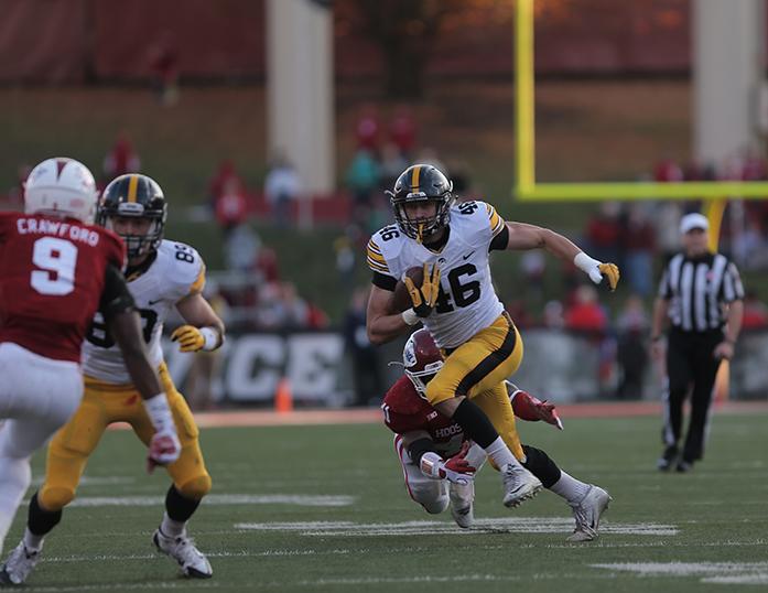 Iowa tight end George Kittle runs for with the ball during the Iowa-Indiana game in Memorial Stadium in Bloomington on Saturday, Nov. 7, 2015. The Hawkeyes stay undefeated after beating the Hoosiers, 35-27. (The Daily Iowan/Margaret Kipsert)
