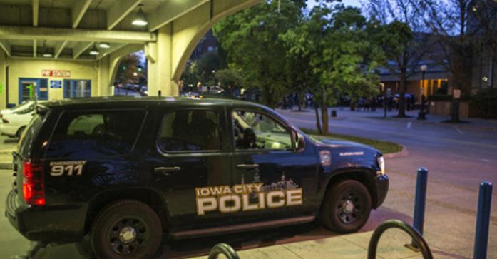A police car sits inside the a parking garage on May 4, 2015. (The Daily Iowan/Sergio Flores)