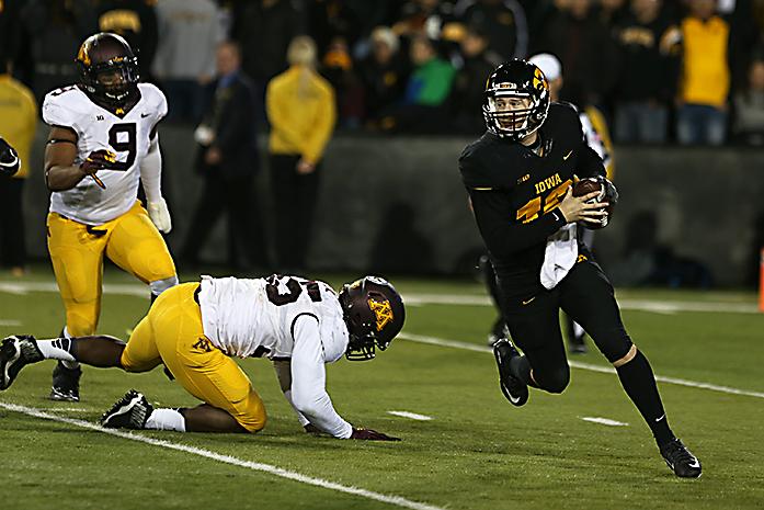 Iowa quarterback C.J. Beathard runs with the ball in Kinnick Stadium on Saturday, Nov. 14, 2015. The Hawkeyes defeated the Golden Gophers, 40-35 to stay perfect on the season. (The Daily Iowan/Rachael Westergard)