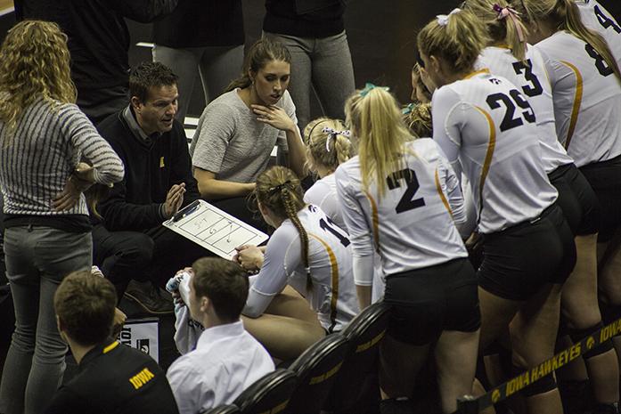 Iowa Head Coach Bond Shymanksy goes over lineup strategy with the team, the Hawkeyes were defeated by the Badgers 3-0 on Friday, Oct. 23, at Carver-Hawkeye Arena in Iowa City.(The Daily Iowan/Anthony Vazquez)