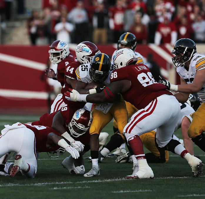Iowa+running+back+Akrum+Wadley+gets+brought+down+by+two+Indiana+defenders+during+the+Iowa-Indiana+game+in+Memorial+Stadium+in+Bloomington+on+Saturday%2C+Nov.+7%2C+2015.+The+Hawkeyes+stay+undefeated+after+beating+the+Hoosiers%2C+35-27.+%28The+Daily+Iowan%2FRachael+Westergard%29