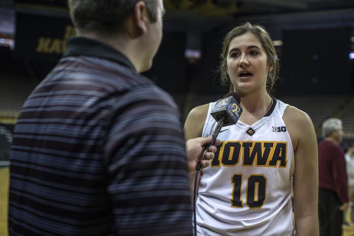 Freshmen+Megan+Gustafson+speaks+to+a+reporter+inside+Carver+Hawkeye+Arena+on+on+Thursday%2C+Oct.+29%2C+2015.+The+team+and+coaches+were+available+to+the+media+for+interviews+and+photos.+%28The+Daily+Iowan%2FSergio+Flores%29