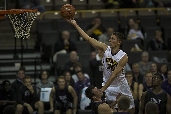 Iowa+forward+Jarrod+Uthoff+drives+against+University+of+Sioux+Falls+in+Carver-Hawkeye+Arena+on+Thursday%2C+Oct.+29%2C+2015.+Uthoff+was+called+for+a+foul+on+this+play.+The+Hawkeyes+defeated+the+Cougars%2C+99-73.+%28The+Daily+Iowan%2FJoshua+Housing%29