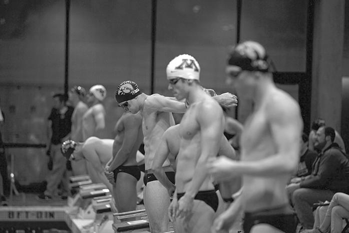 Swimmers from Minnesota and Iowa prepare for their race in the Campus Recreation and Wellness Center on Friday, Oct. 30, 2015. The Hawkeyes fell short to No. 20 Minnesota in the Big Ten Conference Duel Meet. (The Daily Iowan/Brooklynn Kascel)