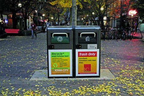 Two new solar powered trash and recycling cans sit in the ped mall on Wednesday, Nov 4, 2015. There are currently four downtown, and if proven successful the city will put in more. (The Daily Iowan/Lexi Brunk)