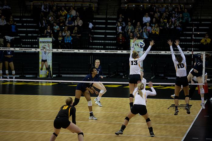 Iowa middle blocker Mikaela Gunderson and setter Loxley Keala jump up to block a ball at Carver-Hawkeye Arena on Wednesday, Nov. 11, 2015. Iowa fell to Penn State, 3-0. (The Daily Iowan/Rachael Westergard)