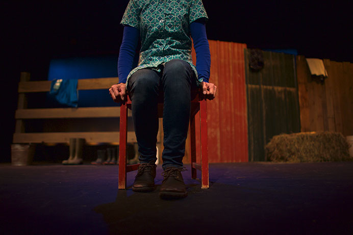 Janet Schlapkohl performs during a dress rehearsal for "Coming of Age in Chore Boots" at Riverside Theater on Monday, Nov. 30, 2015. The one woman show starring Schlapkohl, who also wrote the play, will be opening on December 4th. The play will be showing until December 19th. (The Daily Iowan/Brooklynn Kascel)