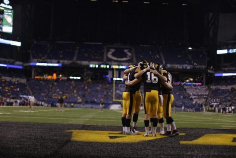 The Iowa kicking team huddles before the Big Ten Championship Game against Michigan State in Lucas Oil Stadium in Indianapolis, Indiana on Saturday, Dec. 5, 2015. 