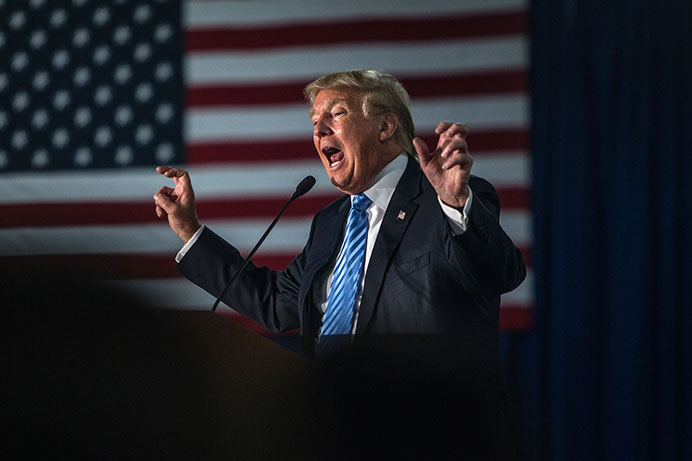 FILE - In this Dec. 5, 2015 file photo, then presidential nominee Donald Trump gives a speech inside Mississippi Valley Fairgrounds in Davenport.
 Trump took to Twitter on July 26 to announce his plan to ban transgender people from serving in the U.S. military. (Sergio Flores/The Daily Iowan, file)