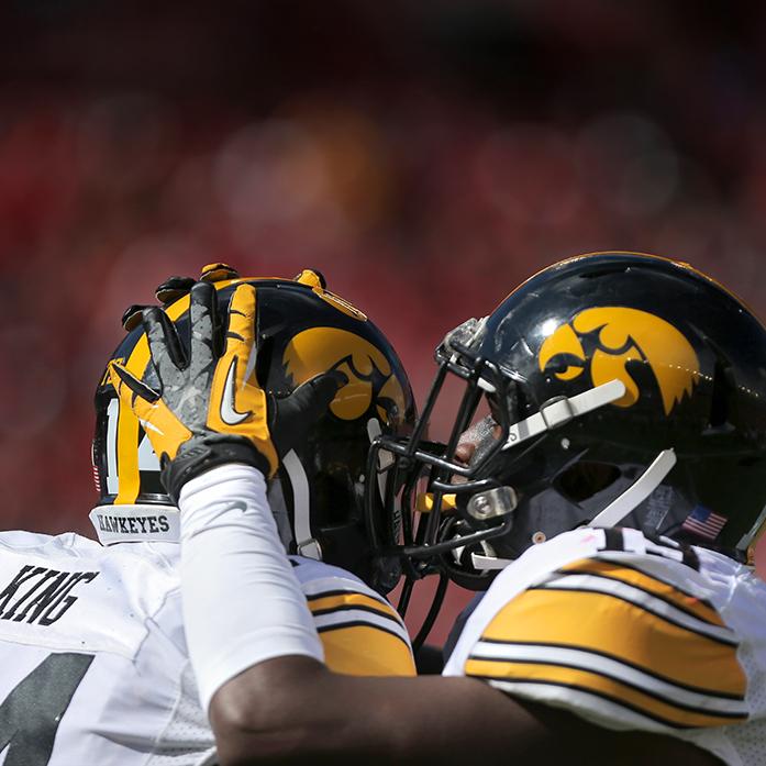 Iowa defensive backs Desmond King and Miles Taylor celebrate together at Camp Randall Stadium in Madison, Wisconsin on Saturday, Oct. 3, 2015. The Hawkeyes defeated the Badgers, 10-6. (The Daily Iowan/Rachael Westergard)