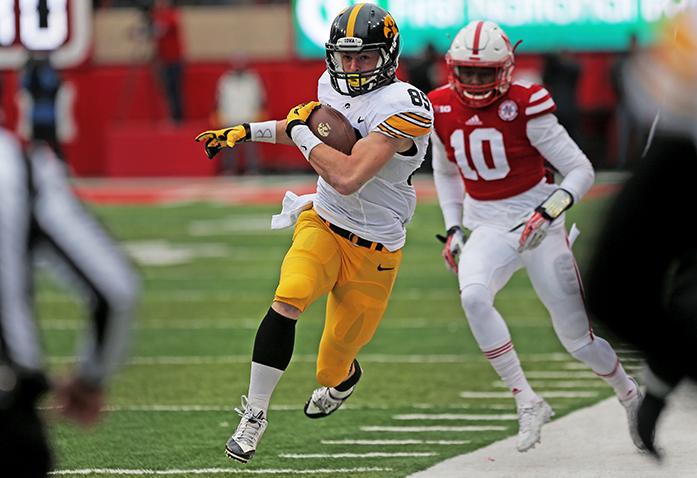 Iowa wide receiver Matt VandeBerg attempts to stay in-bounds during the Iowa-Nebraska game at Memorial Stadium on Friday, Nov. 27, 2015. The Hawkeyes defeated the Cornhuskers, 28-20, to finish off a perfect regular season. (The Daily Iowan/ John Theulen)