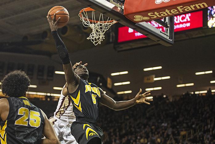 Hawkeye senior Anthony Clemons goes up for a layup in a game against Florida State University on Dec. 2, 2015. Clemons scored 10 points and had four assists in the 78-75 overtime win. (The Daily Iowan/Sergio Flores)
