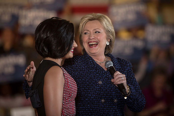 Hillary Clinton thanks Demi Lovoto at the Iowa Memorial Union, for endorsing her campaign on Thursday, Jan. 21. Demi Lavoto performed four songs before Clinton took to the stage to persuade people to caucus for her on Feb. 1. (The Daily Iowan/Jordan Gale)
