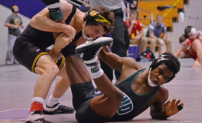 Iowa 125-pounder Thomas Gilman wrestles against Ohio University's Shakur Laney during the 53rd Annual Midland Championships at Welsh-Ryan Arena in Evanston, IL on Tuesday, Dec. 29, 2015. (The Daily Iowan/Valerie Burke)