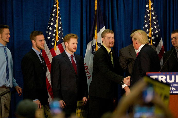 Members of the University of Iowa Wrestling Team meet Donald Trump at a political rally in the Field House on Tuesday, Jan. 26. Trump visited Iowa City to try and persuade voters to caucus for him next week. (The Daily Iowan/Brooklynn Kascel)