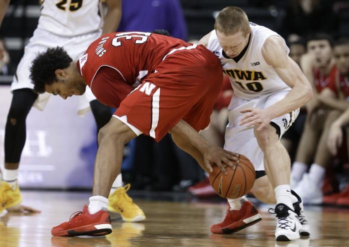 Iowa guard Mike Gesell, right, tries to steal the ball from Nebraska forward Shavon Shields during the second half of an NCAA college basketball game Tuesday, Jan. 5, 2016, in Iowa City, Iowa. Iowa won 77-66. (AP Photo/Charlie Neibergall)