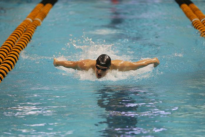 Jerz Twarowski of Iowa races during the third heat of the mens 200 fly on Sunday, Dec. 6, 2015. in the Campus Recreation and Wellness Center. Twarowski finished first with a time of 1:17.04. Iowa won the invitational for the second year in a row. (The Daily Iowan/Brooklynn Kascel)