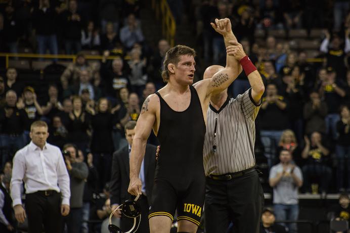 Iowas Sammy Brooks has his hand held up in victory after a tech. fall against Minnesotas Chris Pfarr in 3:00, the #2  Iowa Hawkeyes defeated the #23 Minnesota Gophers 34-6 at Carver-Hawkeyes Arena in Iowa City, IA on Jan. 29 2016(The Daily Iowan/Anthony Vazquez)