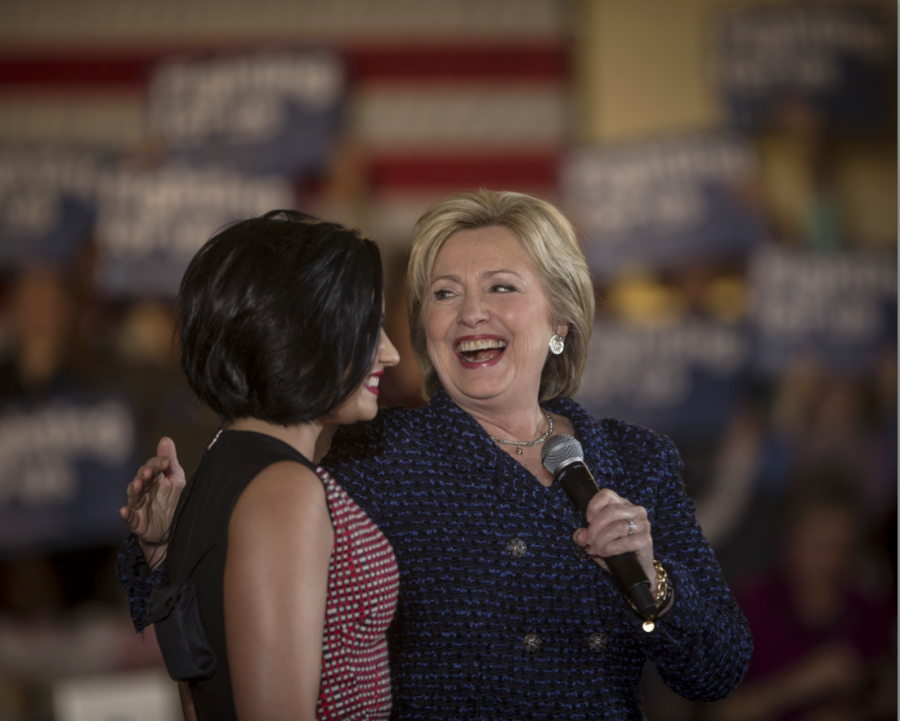 Hillary Clinton thanks Demi Lovato in the IMU on Thursday. Lovato performed four songs before Clinton took to the stage to try to persuade people to caucus for her on Feb 1. (The Daily Iowan/Jordan Gale)