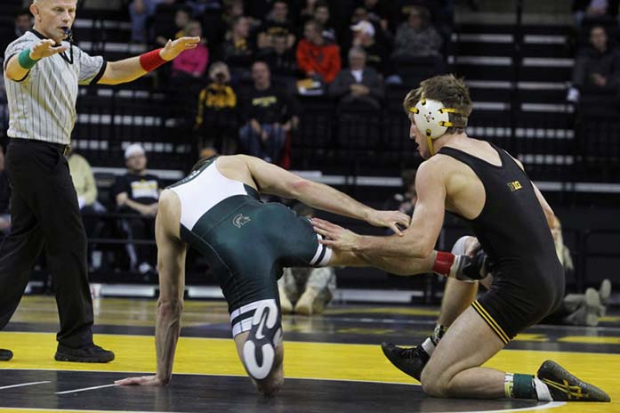 Iowa+149+pounder+Brody+Grothus+wrestles+Michigan+States+Kaelen+Richards+on+Saturday%2C+Dec.+6%2C+2014+at+Carver-Hawkeye+Arena.+Grothus+won+by+tech.+fall.+The+Hawkeyes+defeated+the+Spartans%2C+37-0.