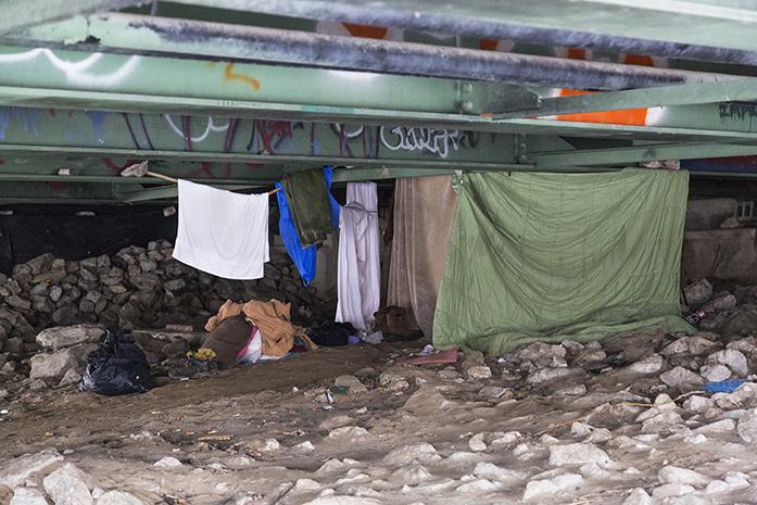A makeshift home is photographed under an Iowa River bridge on Wednesday, Jan. 27 2016.  Poverty rates in Johnson County are on the rise.  (The Daily Iowan/Eden Hall)