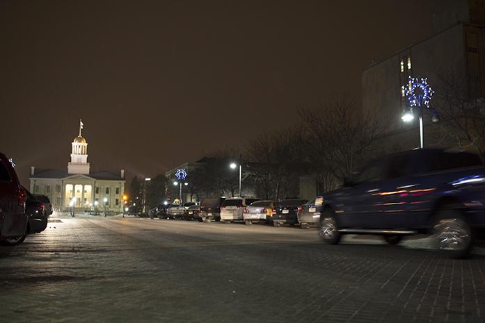 Cars drive down Iowa Ave. on Tuesday Jan. 19, 2016. Uber, a popular driving company, looks to operate through Iowa City. (The Daily Iowan/Mary Mathis)