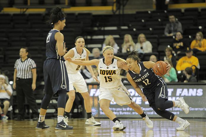 Iowa point guard Whitney Jennings pushes against Penn State point guard Lindsey Spann in Carver-Hawkeye Arena on Wednesday, Jan. 20, 2015. Iowa was defeated by Penn State, 82-69. (The Daily Iowan/Courtney Hawkins)