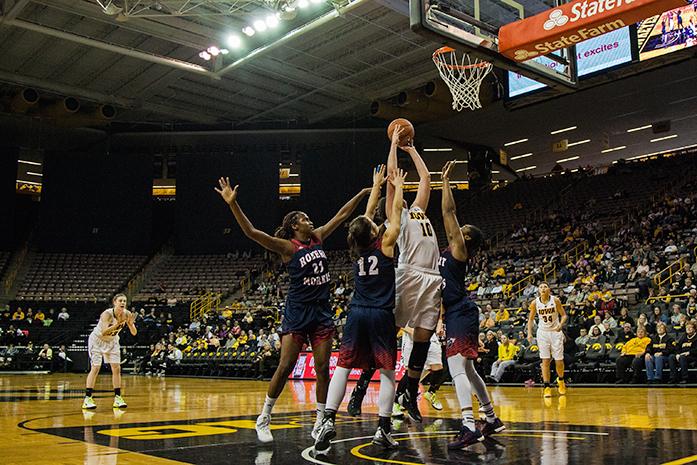 Iowa forward Megan Gustafson stretches above the Robert Morris defense for a basket, the Hawkeyes defeated the Colonials 69-50  at Carver-Hawkeye Arena in Iowa City,Iowa on Dec. 6,2015(The Daily Iowan/Anthony Vazquez)