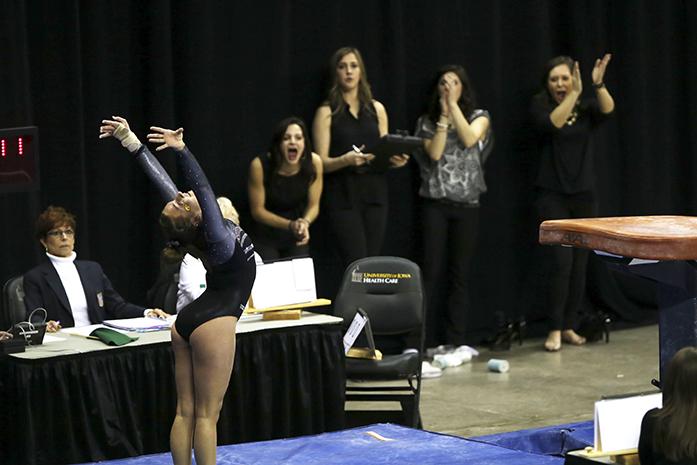 Iowa women’s gymnast Caroline McCrady after successfully landing on the vault at the Iowa vs. Utah State meet held at Carver-Hawkeye Arena on Saturday, Jan 11, 2014. The Hawkeyes team lost to the Utah State Aggies 191.75-191.65. (The Daily Iowan/ Tyler Finchum)