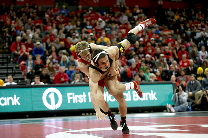 Iowa 141-pounder Topher Carton is thrown down by Nebraskas Anthony Abidin during the Iowa-Nebraka match in the Devaney Center in Lincoln, Nebraska on Sunday, Jan. 24, 2016. The Hawkeyes defeated the Cornhuskers, 21-11. (The Daily Iowan/Margaret Kispert) 