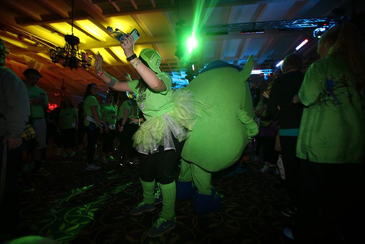 UI senior Abby Dusen dances with Mike Wazowski from Monsters, Inc. during the second hour at the 22nd Dance Marathon in the Iowa Memorial Union on Friday, Feb. 5, 2016. Dance Marathon is a 24 hour long event, where the participants stay standing for the entire time. (The Daily Iowan/Margaret Kispert)